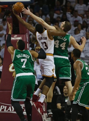 The Cleveland Cavaliers Tristan Thompson (13) battles for a rebound with the Boston Celtics Jared Sullinger (7) and Tyler Zeller (44) in the second quarter during Game 2 of the Eastern Conference quarterfinals at Quicken Loans Arena in Cleveland on Tuesday, April 21, 2015. The Cavs won, 99-91, for a 2-0 series lead. (Ed Suba Jr./Akron Beacon Journal/TNS)