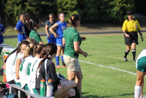 Coach Casey leading her team from the sidelines