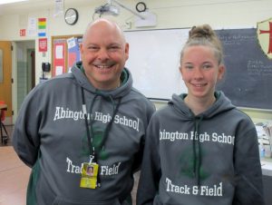 The author (Megan Reid) with Coach Lanner. Megan is a member of the girls track team.