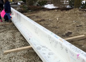Signature and messages on last beam to be placed during construction of the new Abington School Building.