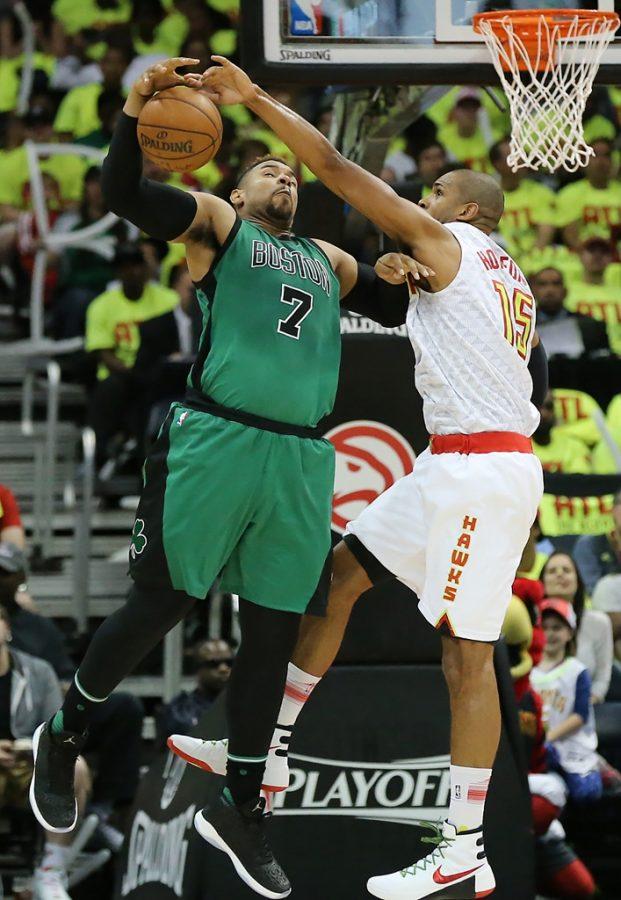 The Atlanta Hawks Al Horford, right, blocks a shot by the Boston Celtics Jared Sullinger and forces a turnover in the Eastern Conference quarterfinals at Philips Arena in Atlanta on Saturday, April 16, 2016. (Curtis Compton/Atlanta Journal-Constitution/TNS)