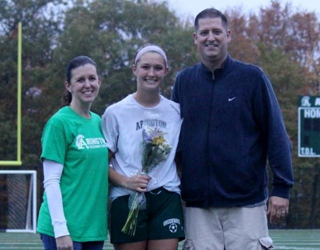 Jenny Worden (shown here celebrating senior day for girlss soccer with her parents) is headed to Stonehill College