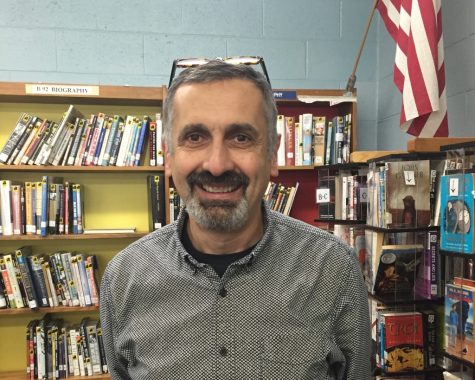 Art Director Mr. Di Rado, standing in the Abington High School Library Media Center in November of 2016.