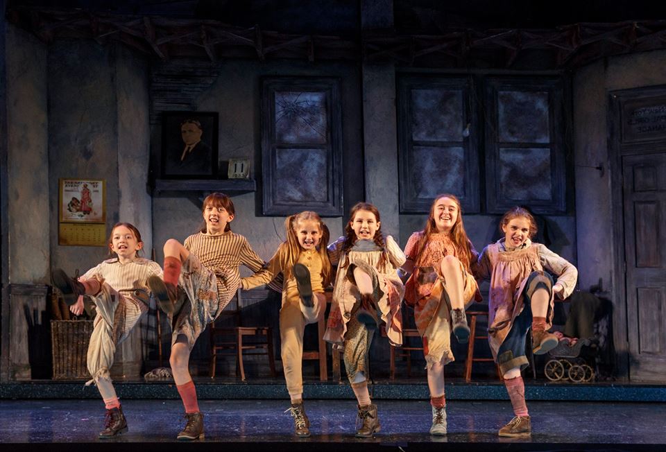 The Orphans perform in Annie.