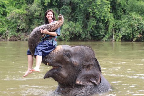 Sra. Flaherty makes friends with an elephant during one of her many trips abroad, this one to Thailand.