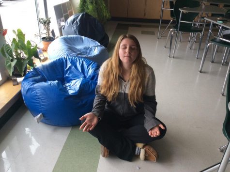 Abington High School junior Kaitlyn Polito has learned meditation practices in her period 7 Mind/Body/Spirit class with Mrs. Daisy. Here she is in English class, having completed her class assignment on Friday, March 29, 2019.