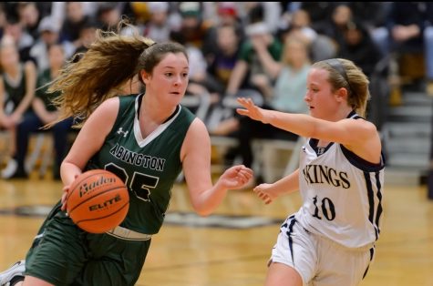 Senior captain Kristyanna Remillard drives to the hoop against an opponent during the Abington vs. East Bridgewater Quarterfinals on March 2, 2019.