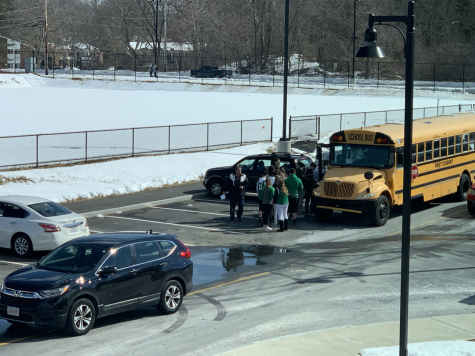 After school, Abington students board one of the three fan buses to the State Semi-Finals at the TD Garden in Boston on Tuesday, March 12, 2019.