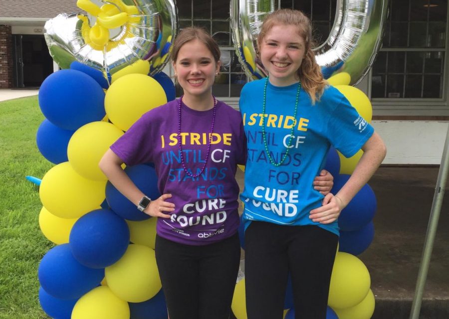 Abington High School freshmen Amanda Murphy (left) and Jackie Earner celebrate at the end of the Great Strides Walk to find a cure for Cystic Fibrosis. The walk took place in May of 2018.