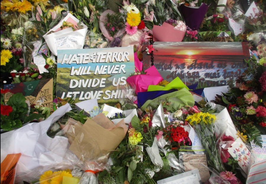 Hate and terror will never divide us poster at Christchurch mosque shooting memorial, Thursday 21 March 2019