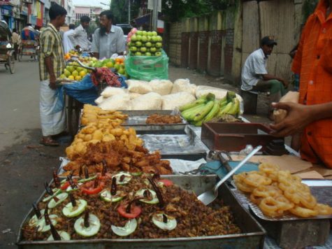 During break of fasting (Iftar) food vendors are seen all around corner streets selling delicious snacks. The vendors compete by seeking customers attention with fanfare.