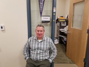 Mr. James Donohue, Special Education Coordinator at Abington High, sits outside his office in the guidance wing on Wednesday, May 1, 2019.