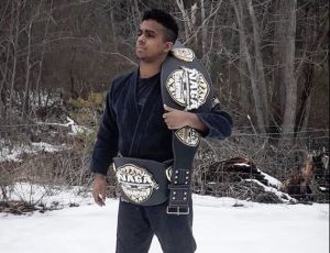 Abington Freshman Helvecio Junior with two of his North American Grappling Association Championship belts. 2019.