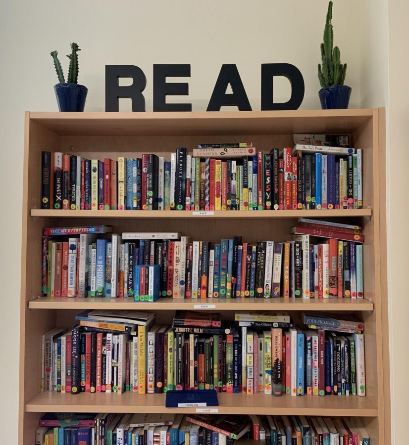 This bookcase seen in English classroom room 2215 on Tuesday, Oct. 1, 2019 is overflowing with books encouraging students to read.