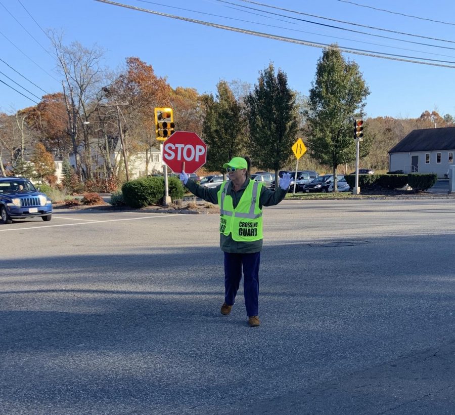 On November 6, 2019, crossing guard Ms. Mary Ann Mattes helps students cross the busy intersection of Rt. 18, Lincoln Blvd., and Gliniewicz Way in Abington.
