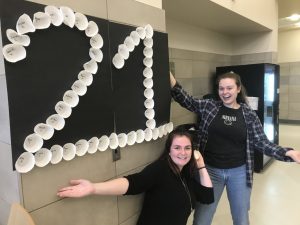 Maura Odell (left) and Rachel Barrett, as juniors at Abington High School, decorating the cafeteria in preparation of the 2019 Pep Rally
