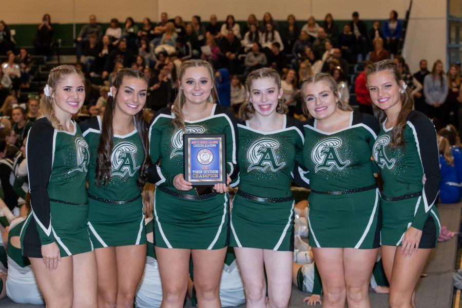 Seniors (left to right): Haven DiMambro, Julie Warsheski, Kerry Cardinal, Erin McDermott, Mikayla Littman, and Emmalee Ezzell posing with their first place plaque at the cheerleading competition held on Wednesday, November 6, at Abington High School.