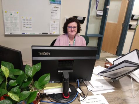 Mrs. Paula Potter, Guidance Secretary at Abington High, sitting in her office in the guidance wing on Monday, December 9, 2019.