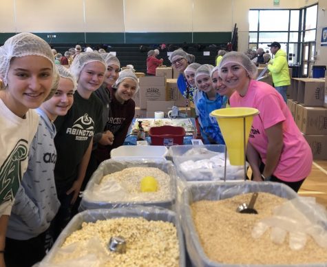 Members of the Abington Girls Soccer Team help to package food during the community event, held in the gym, on Friday, November 22, 2019. Over 600 people donated to the effort of making 250,000 meals. Pictured (left side, front to back): Hannah Tirrell, Ellie Lindo, Delaney McCann, Zoe Balewicz, Carrie Prewitt. (right side, front to back): Gracie OConnell, Isabella OConnell, Caitlin Noble, Cecelia Lindo, Ava Bickford