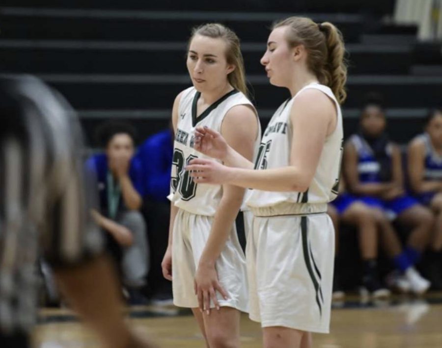 On January 23, 2109, from left to right Gracie OConnell and Isabella OConnell talking behind the three point line during a free throw shot at Abington High School gymnasium