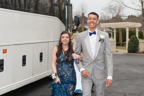 Cam Curney (right) escorts Sam Johnson to Canoe Club Ballroom for the 2019 Junior Class Prom in East Bridgewater on Friday, March 29, 2019. Curney was named Prom King.