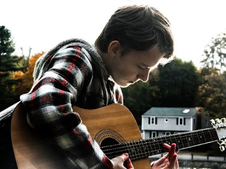 Senior Sean Moran plays guitar at Island Grove, Abington, MA on October 19, 2018. 