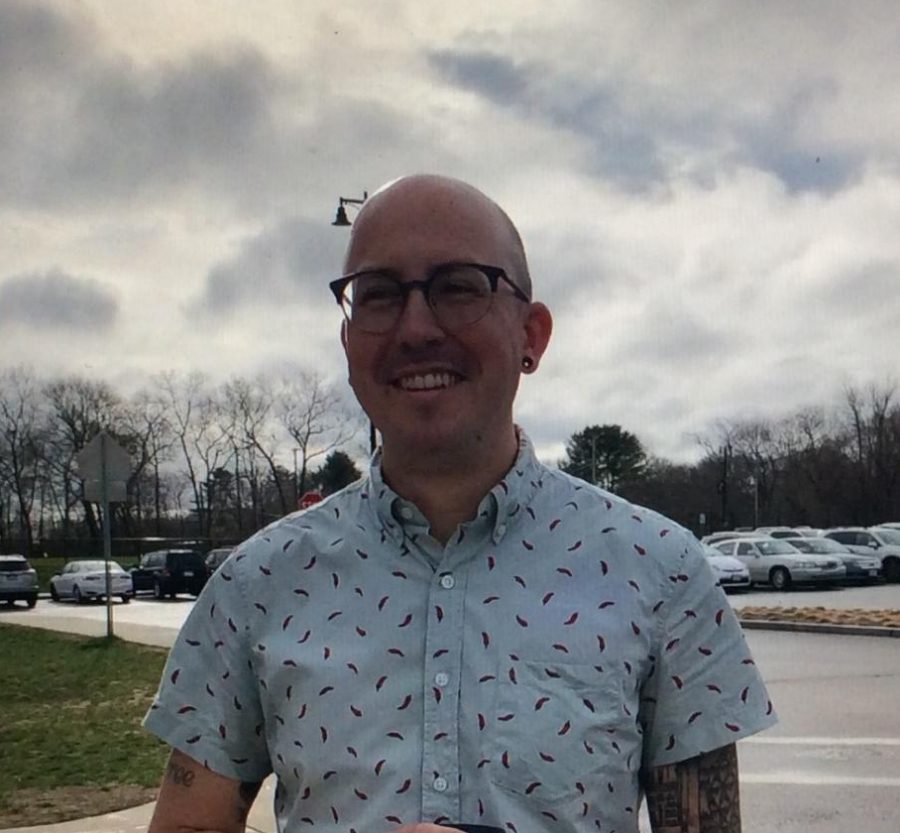 Abington High School English teacher and Class of 2021 Advisor Mr. Matthew Cutter stands outside of Abington High School on Monday, April 12, 2021, the first day all students returned to school since March of 2020.