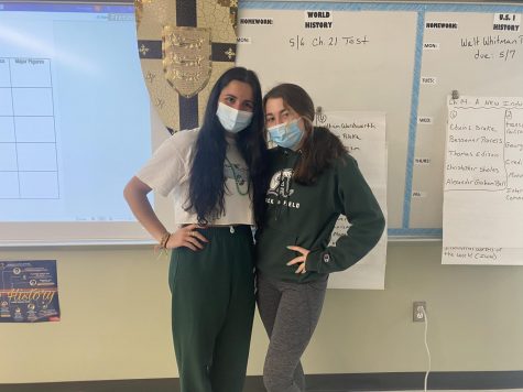 Abington High School junior Gabriela Maciel and sophomore Madison Carini (left to right) wear Abington colors and insignia to celebrate Abington Pride on the last day of Spirit Week on Friday, April 30, 2021.