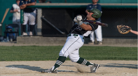 Abington senior Aaron Siegel at bat for the Green Wave in May of 2021.