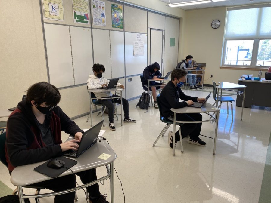 Socially+distanced+and+masked%2C+Abington+High+School+students+Collin+Maynard%2C+Anthony+Tofuri%2C+Sam+Valle%2C+Kyle+McQueeny%2C+and+Antonio+Carolos+Andrade+sit+in+class+May+of+2021.