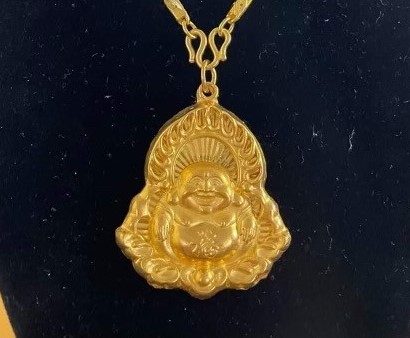 This pendant of Buddha is worn to represent what you believe in, the way a Catholic might wear a cross. It’s also for good luck, Cambodian families usually have mini golden statues of Buddha for good luck or a good omen.