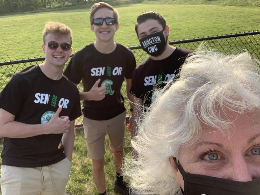 The Weekly Wave digital team (left to right): Aaron Johnson, Derek Tirrell, and Matt Lyons with the newspaper advisor Ms. Patricia Pflaumer during the senior car decorating activity in May of 2021 at Abington High School.
